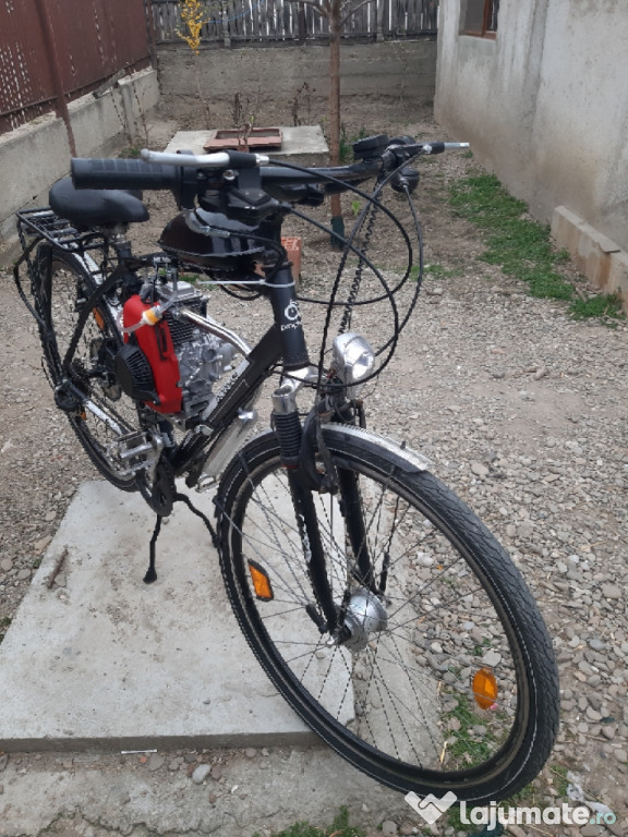 Bicicletă cu motor an 4t. și pornire de pe loc cu demarol