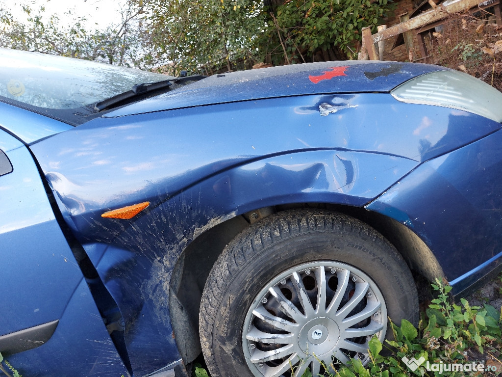 Ford focus 1.6 an 99 benzina pt mai multe detalii 