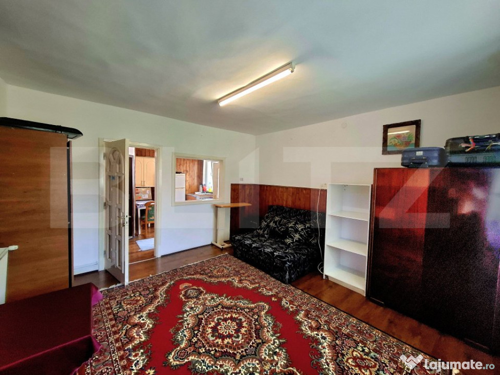 Casa cu 4 apartamente si curte proprie ,suprafata utila 122m