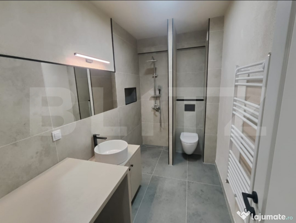 Apartament cu o camera, ultrafinisat, lift, garaj, zona Eroi