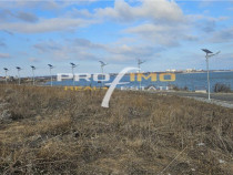 Teren 965mp.deschidere la 3 strazi, pe malul Lacului Techirg