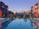 Apartament cu 2 camere, parcare privată și acces la piscin