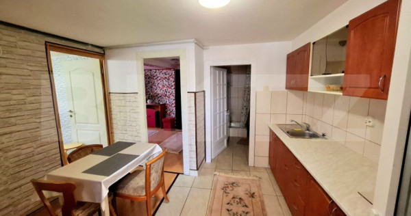 Casa cu 4 apartamente si curte proprie ,suprafata utila 122m